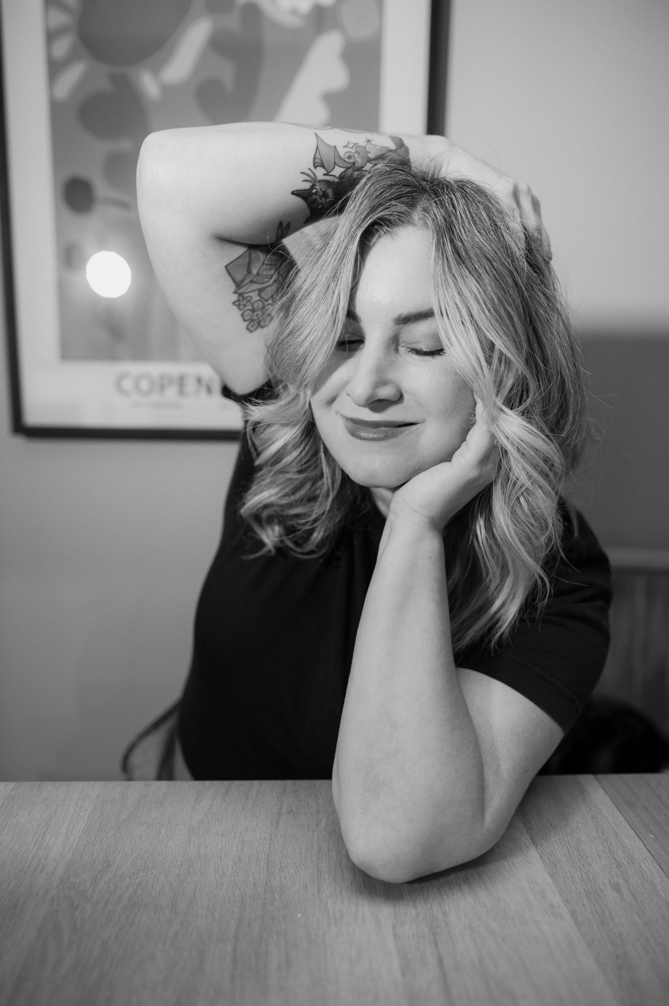 A portrait of London Wedding photographer Ellie Gillard throwing confetti